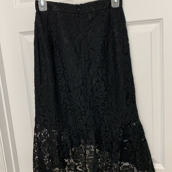 DO BE Size Small lace sexy black skirt.  Mini skirt lining with lace ruffle - Picture 2 of 8